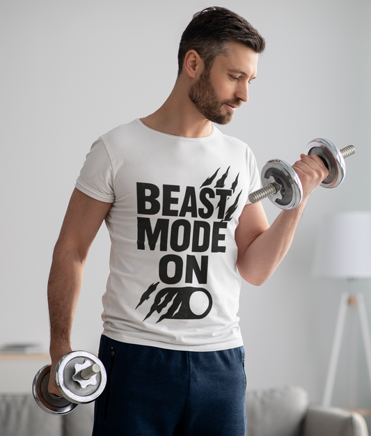 Man lifting weights wearing a 'Beast Mode On' t-shirt in a home setting.